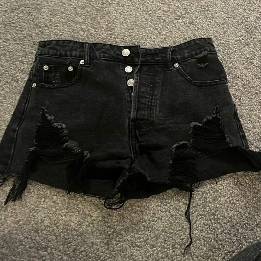 Black Adika distressed Jean shorts.
